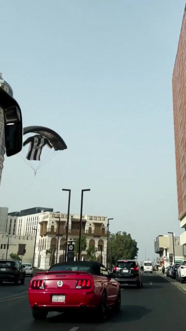 NUFC Arabia Shirt Paragliding Over Street in Jeddah