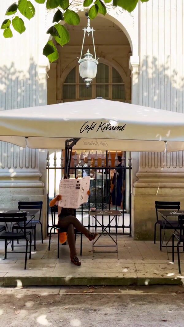Café Kitsuné Barista Fox Reads Newspaper
