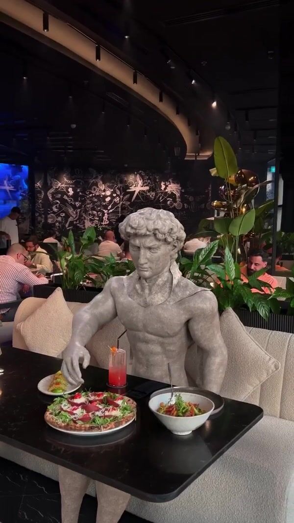 Amaya Dubai Marble Statue Taking Photo
