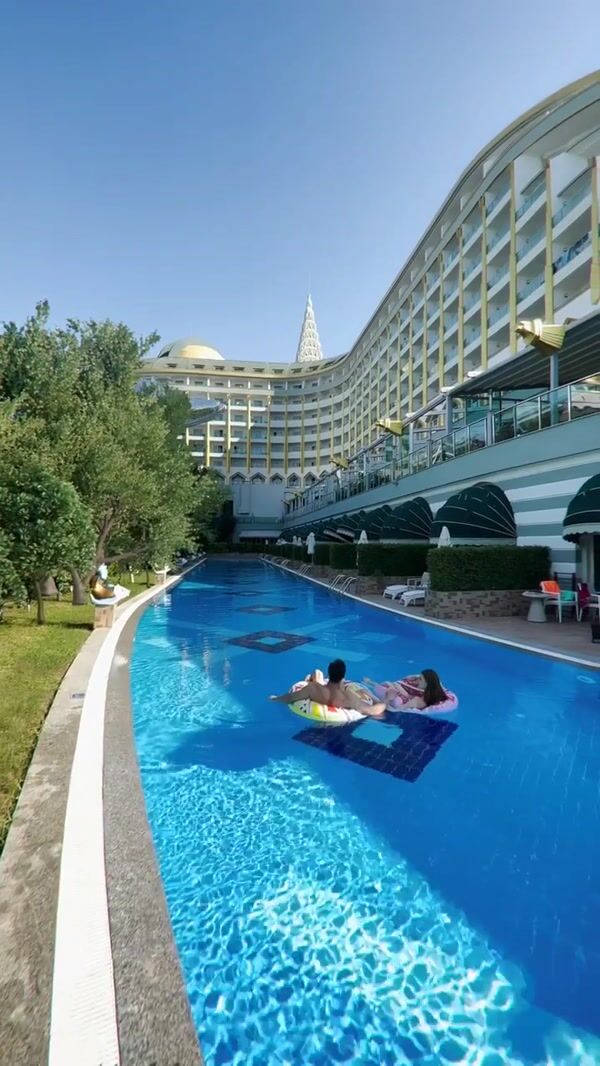 Delphin Hotels Silver Dolphin Glides Above the Pool