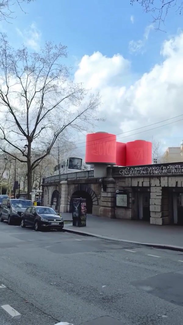 Renova Train Passes Through Giant Red Roll