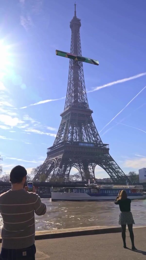 Ville De Paris Banner Rolls Down the Eiffel Tower