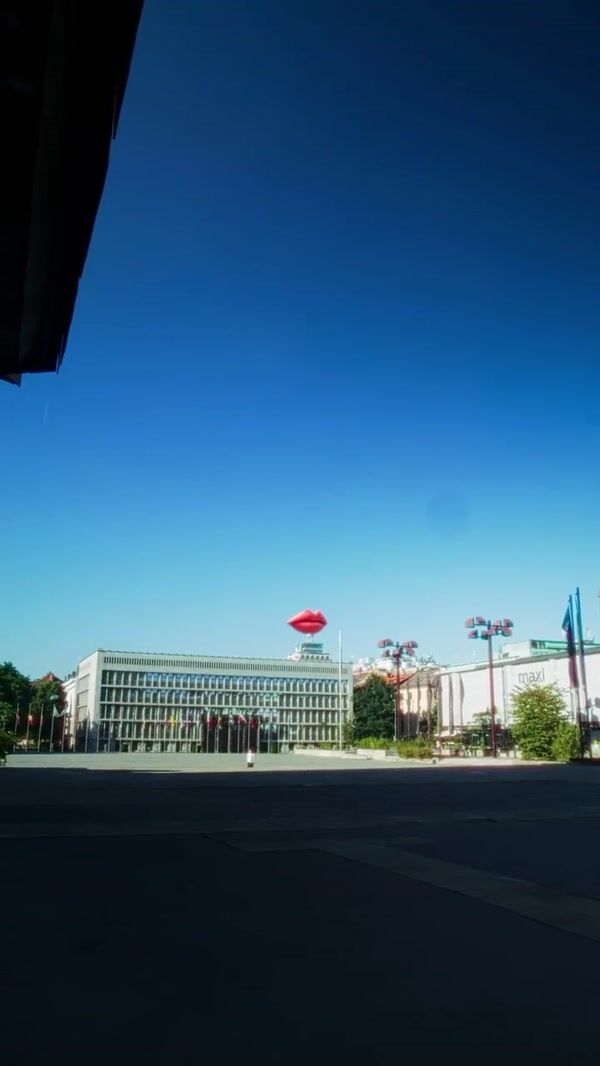 Smile Inflatable Lips Lying Above Buildings