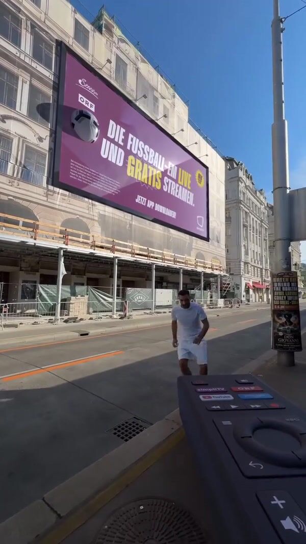 SimpliTV Footballs Burst from Billboard in Vienna