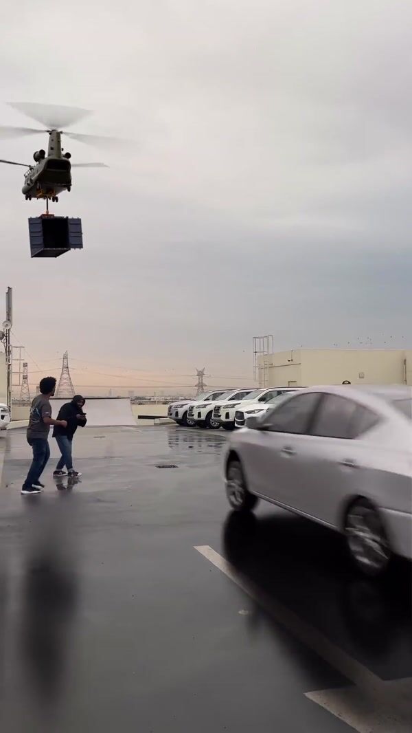 Automax Car Jumps onto Boxship from Helicopter