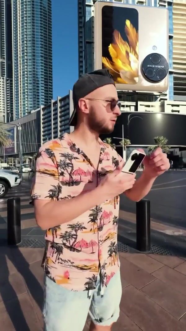 Oppo Flip Phone Opening on Building Facade