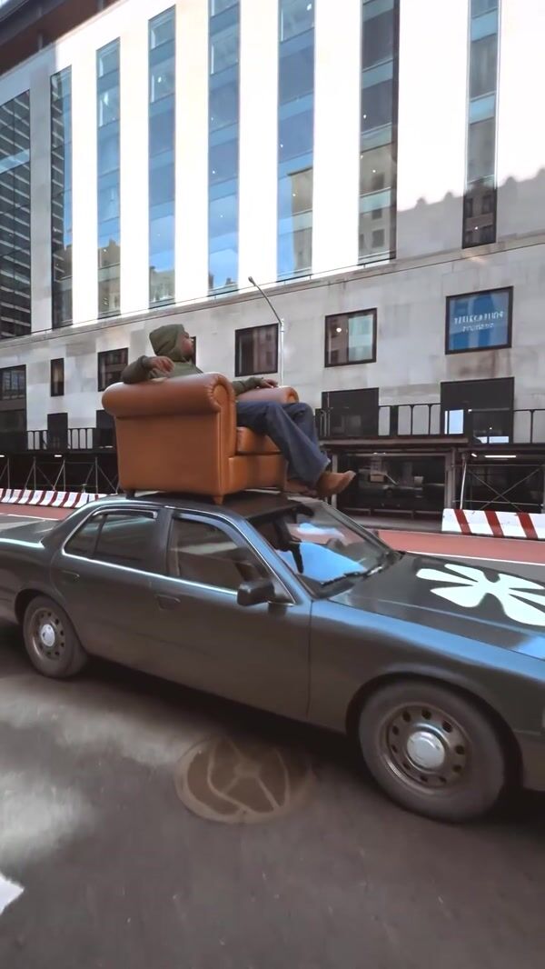 House of Pezzo Man on Couch on Car Roof