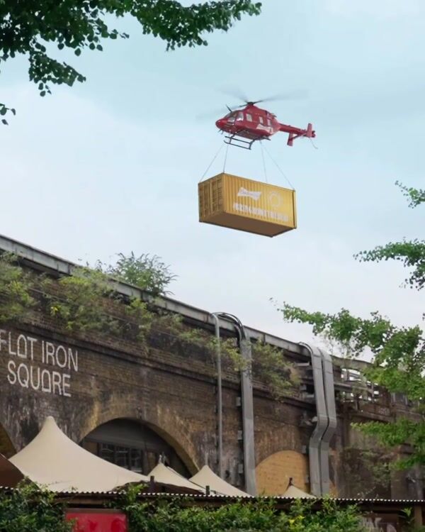 Budweiser Helicopter Airlifts Boxcar Over Flat Iron Square