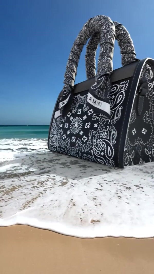 AMIRI Black Bag Wave Splash at the Beach