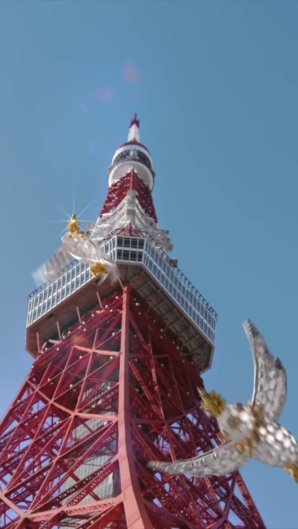 Birds Carrying Yellow Diamond Above Tower