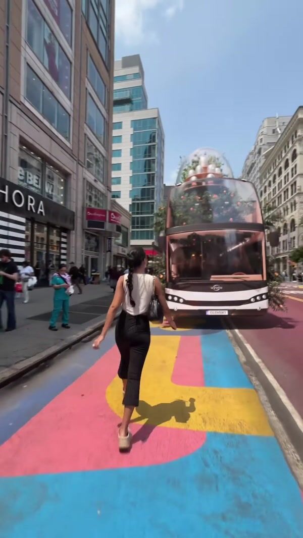 OLEHENRIKSEN Woman Takes Products from Bus