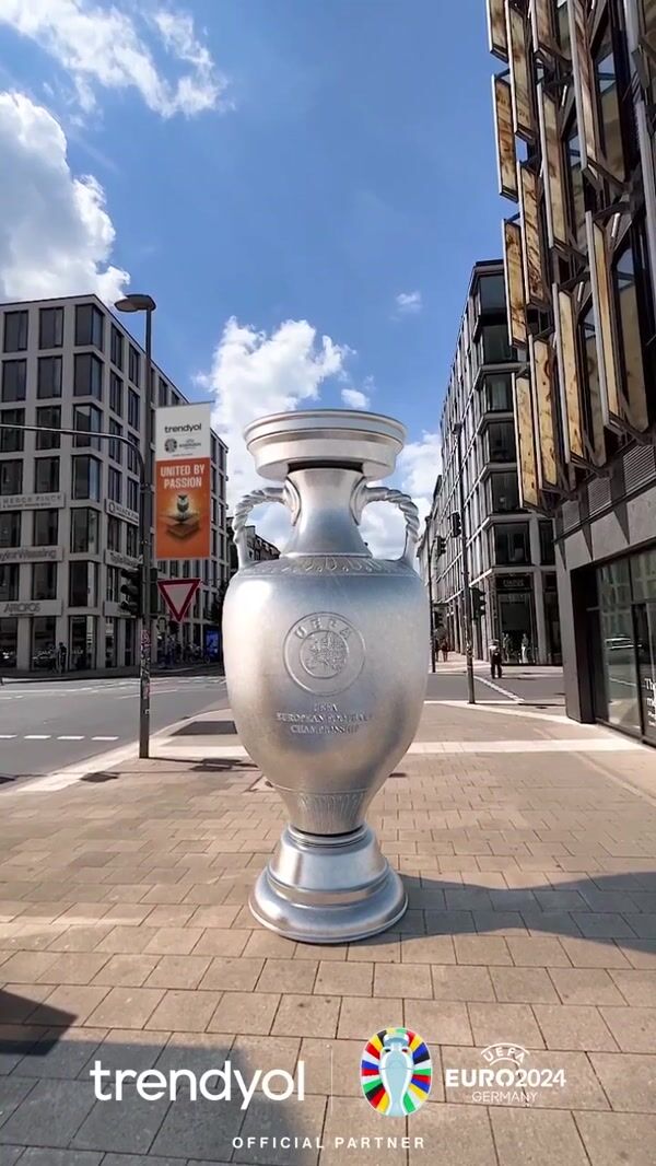 Trendyol Football Trophy Stands on the Sidewalk