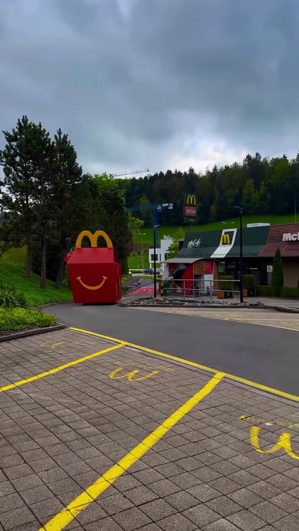 McDonald's Giant Happy Meal Box Glides Through Street