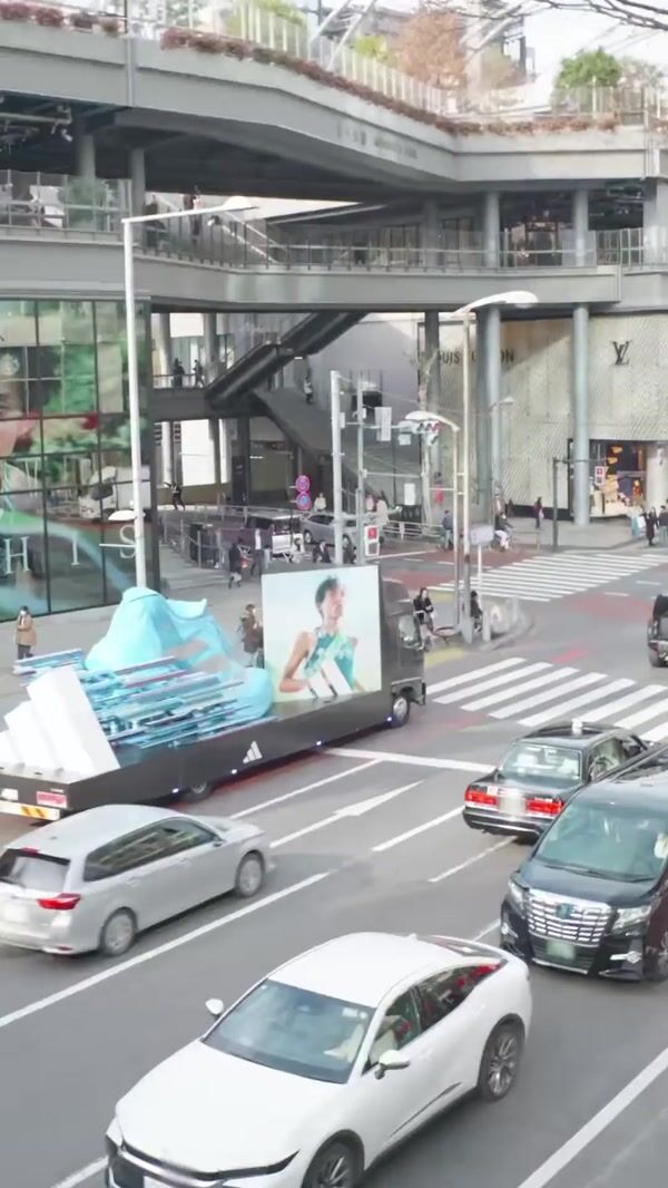 Adidas Giant Sneaker Moves Through Tokyo Streets