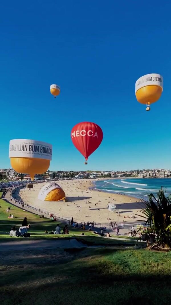 Mecca Beauty Cream Hot Air Balloons Float at Beach