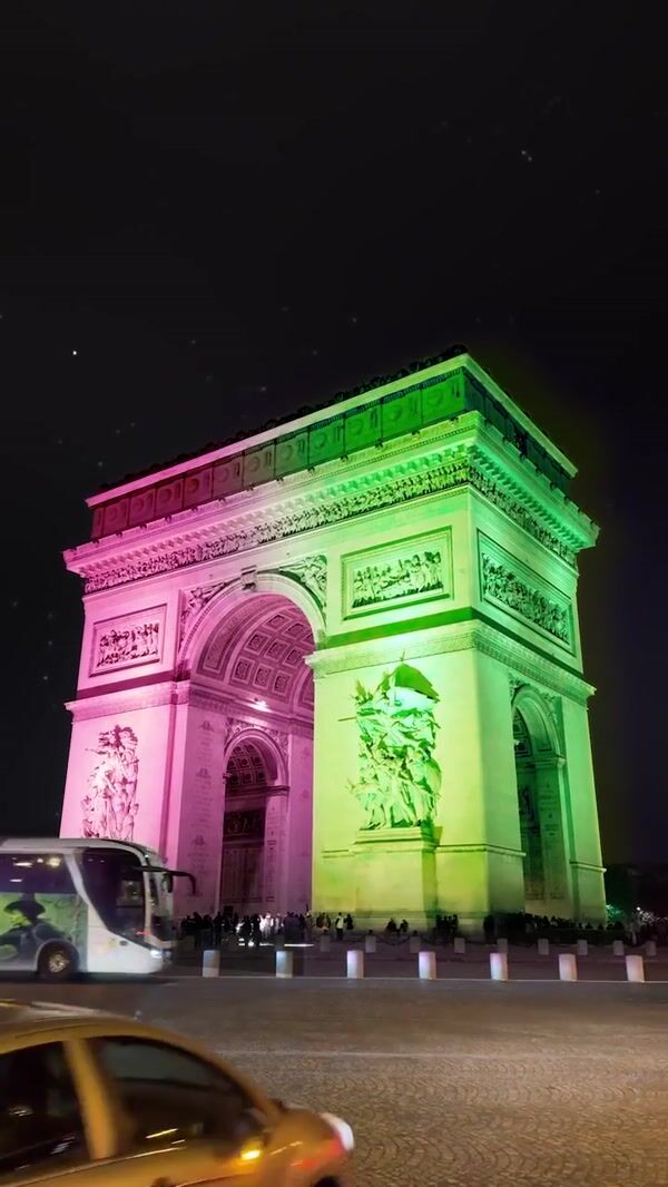 Universal Arch Lights Up in Green and Pink