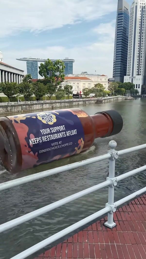 Chope Chili Sauce Bottle Floating on River