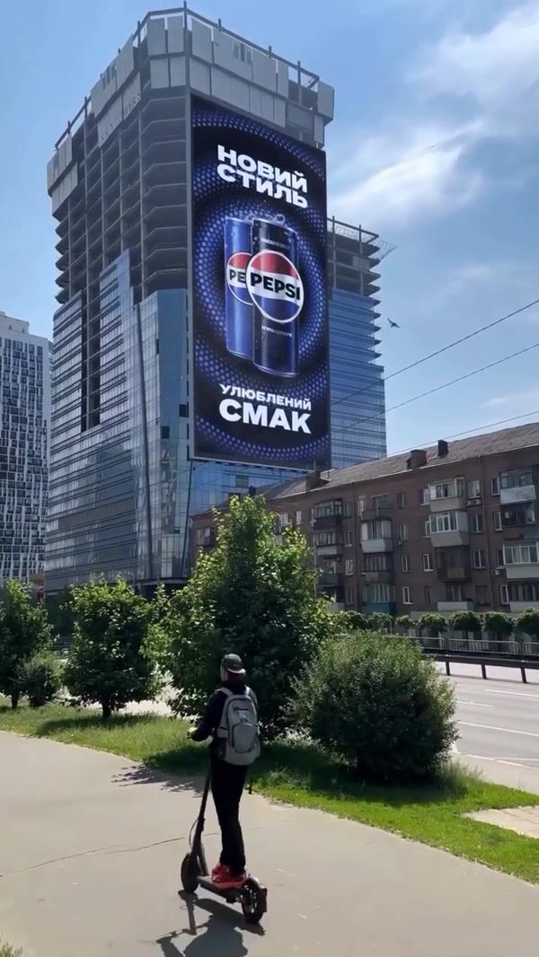 Pepsi Giant Can on Car Emerges from Billboard