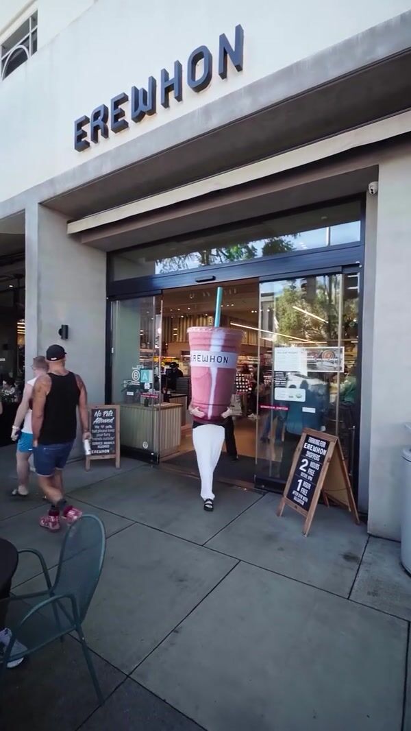 Erewhon Woman Carries Smoothie Cup