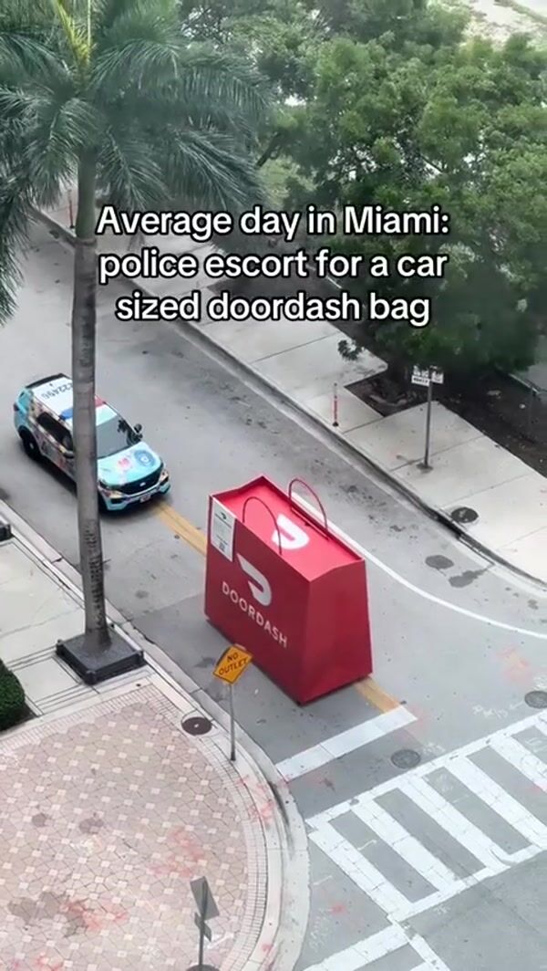 Secret Miami Giant DoorDash Bag on Street