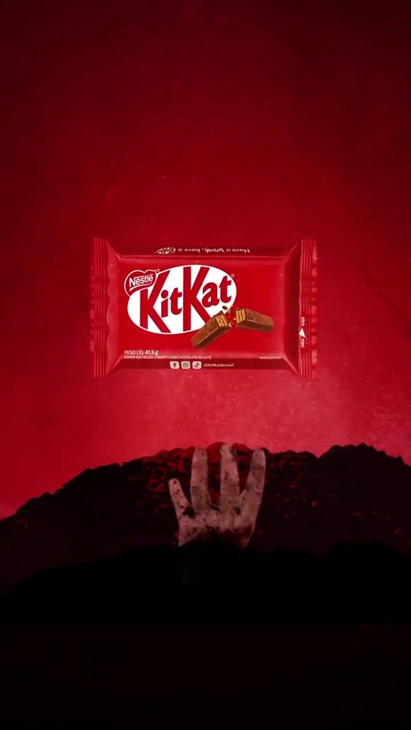 KitKat Bar Reached by Hands from Soil