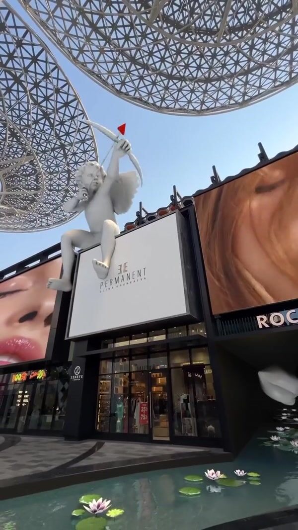 Elle Cupid Shooting Arrows on Inflatable Lips