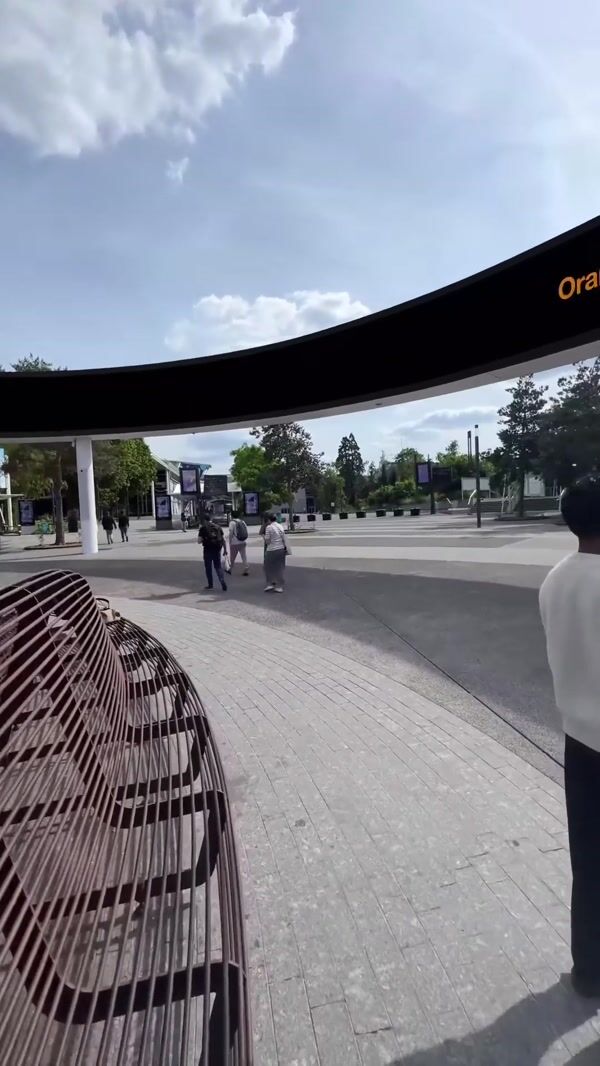 Orange Portal Opens from Pavement