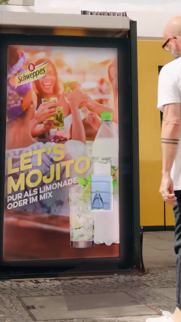 Schweppes Bottle Dispenser on Bus Stop Ad