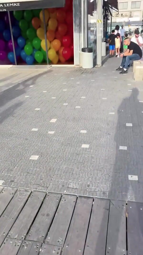 Carolina Lemke Rainbow Balloons Rising from Store