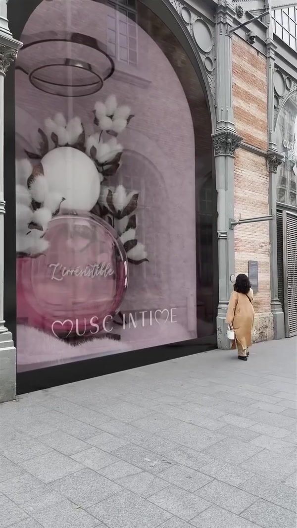 Musc Intime Cotton Blooms Beside Perfume Bottle