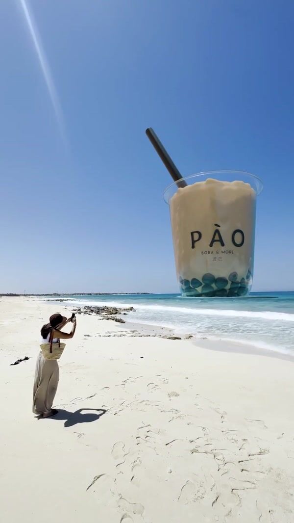 PÀO Two Giant Bubble Teas Tower Over Beach