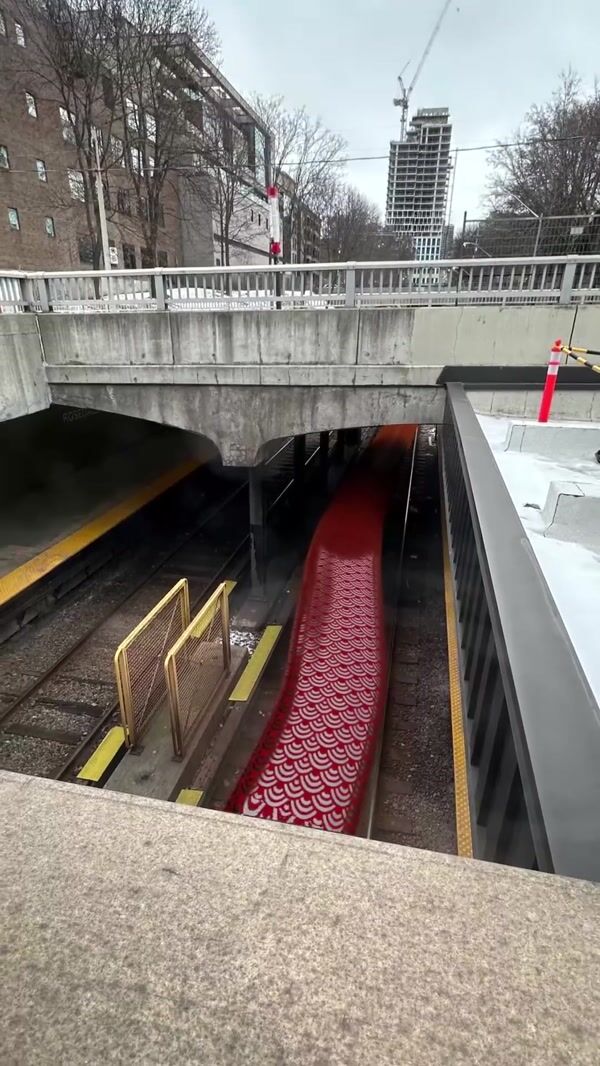 Toronto Transit Red Snake Slithers on Tracks