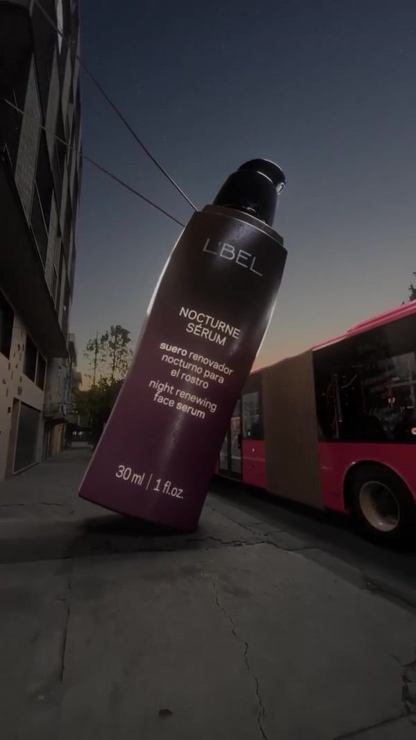 L'BEL Bottle Pours Serum on Bus
