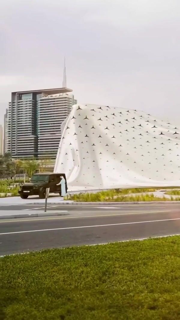 Mercedes-Benz Car Pulls Cloth to Unveil Building