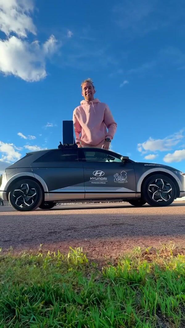 Hyundai Giant Man Leaps and Shrinks Beside Car