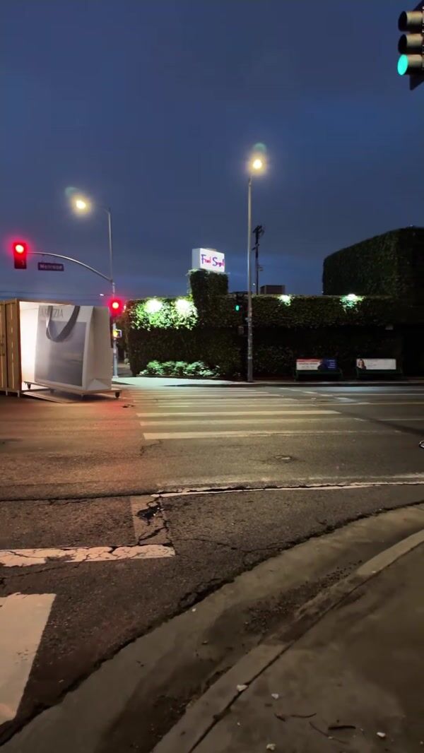 Aritzia Giant Shopping Bags Roll Across Street
