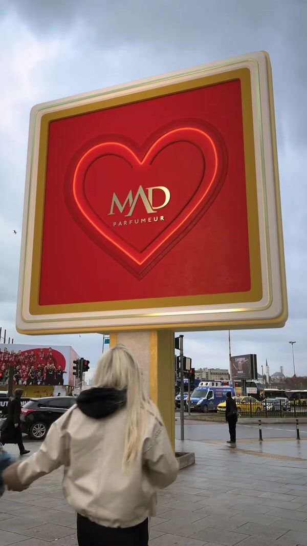 MAD Parfumeur Perfume Sprays Over Couple