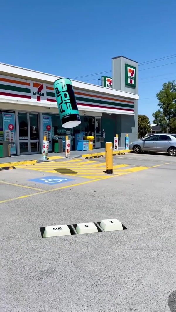 Flipside Energy Giant Cans in Front of 7-Eleven