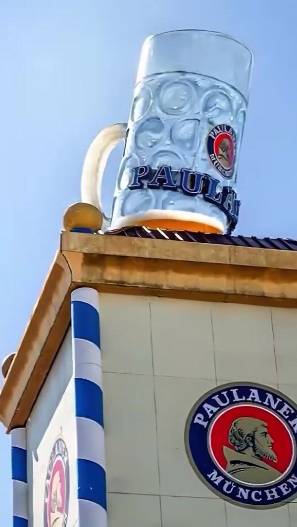 Paulaner Giant Beer Mug Overflows Atop Building