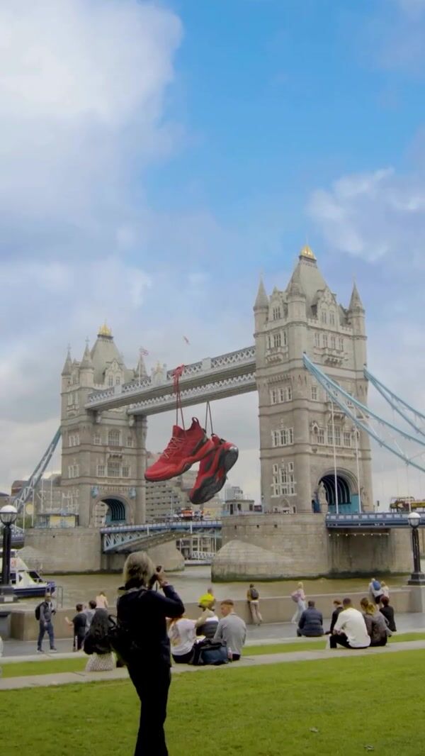 Adidas Giant Shoes Hanging on Tower Bridge