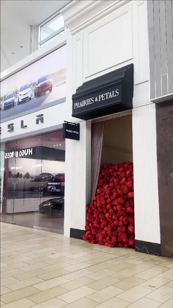 Prairies & Petals Red Roses Overflow in Mall Walkway