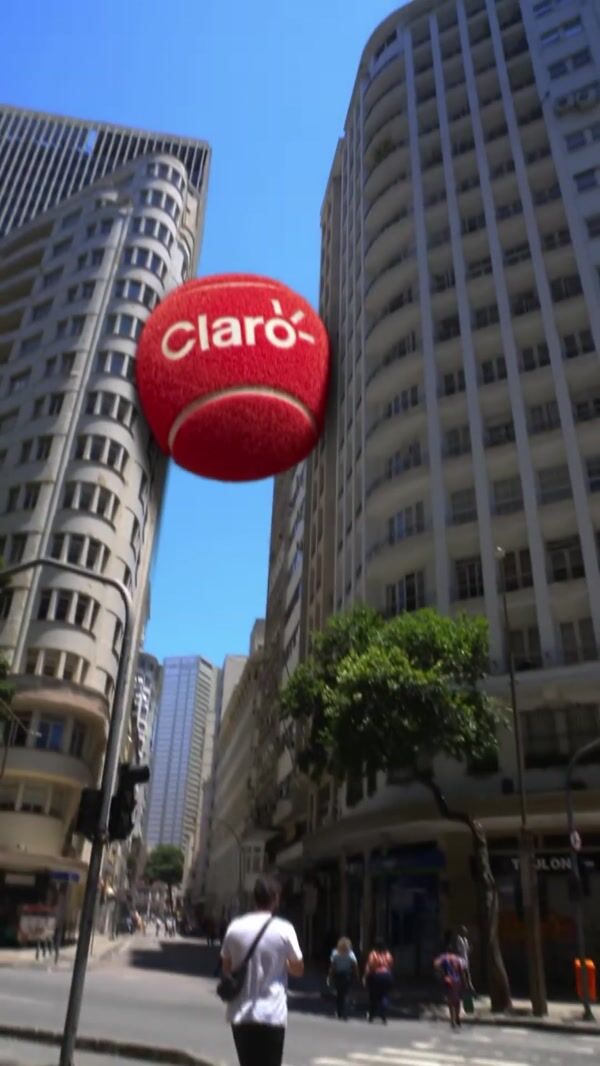 Claro Red Tennis Ball Wedged Between Buildings
