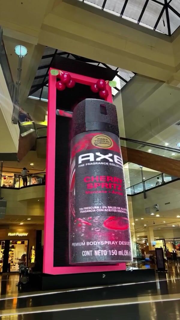 Axe Bottle Rotates as Banner Rolls