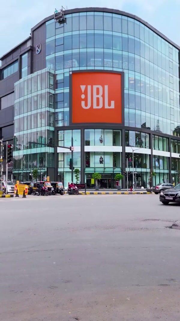 JBL Giant Earbuds Emerge from Building Facade