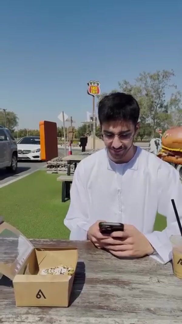 Last Exit Dubai Burger Mascot Approaches Car