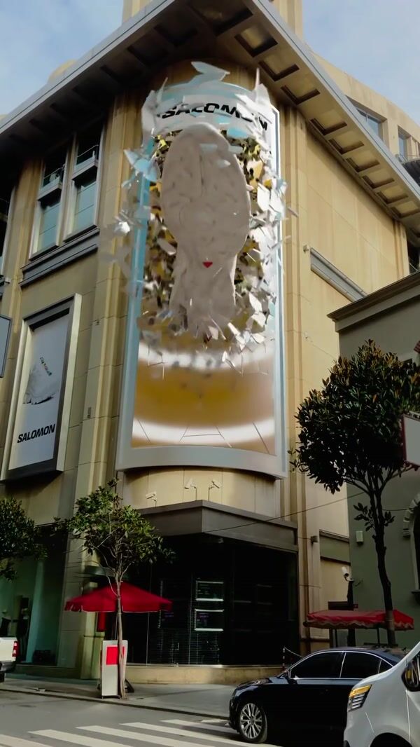 Salomon Giant Sneaker Crashes Through Facade