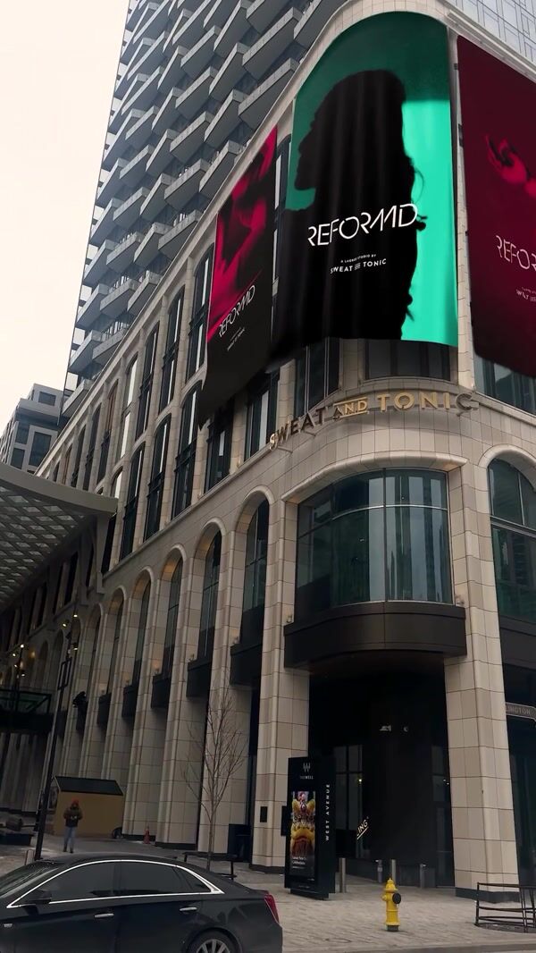 Reformd Brand Banners Wave Outside Building