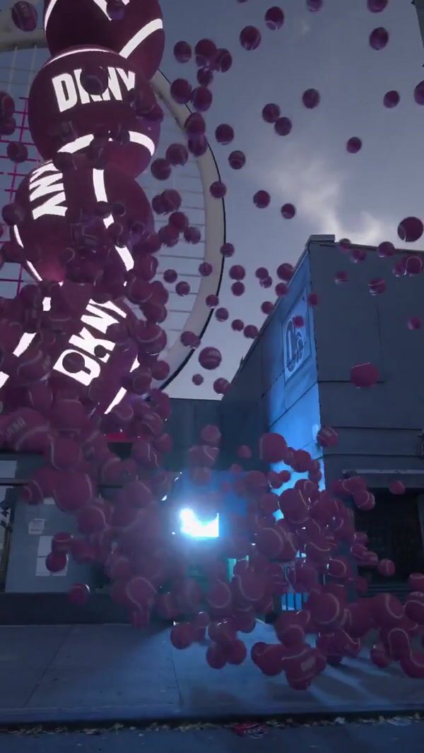 DKNY Pink Tennis Balls Float in Street Side