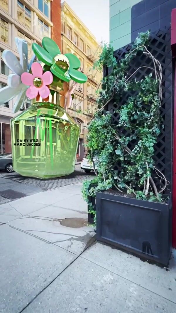 Marc Jacobs Perfume Bottle with Daisy Cap on Road