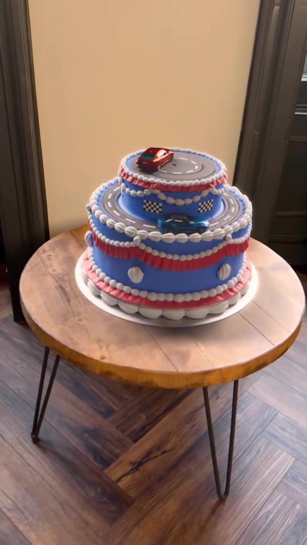 BMW Miniature Cars Drifting Above Cake at Home